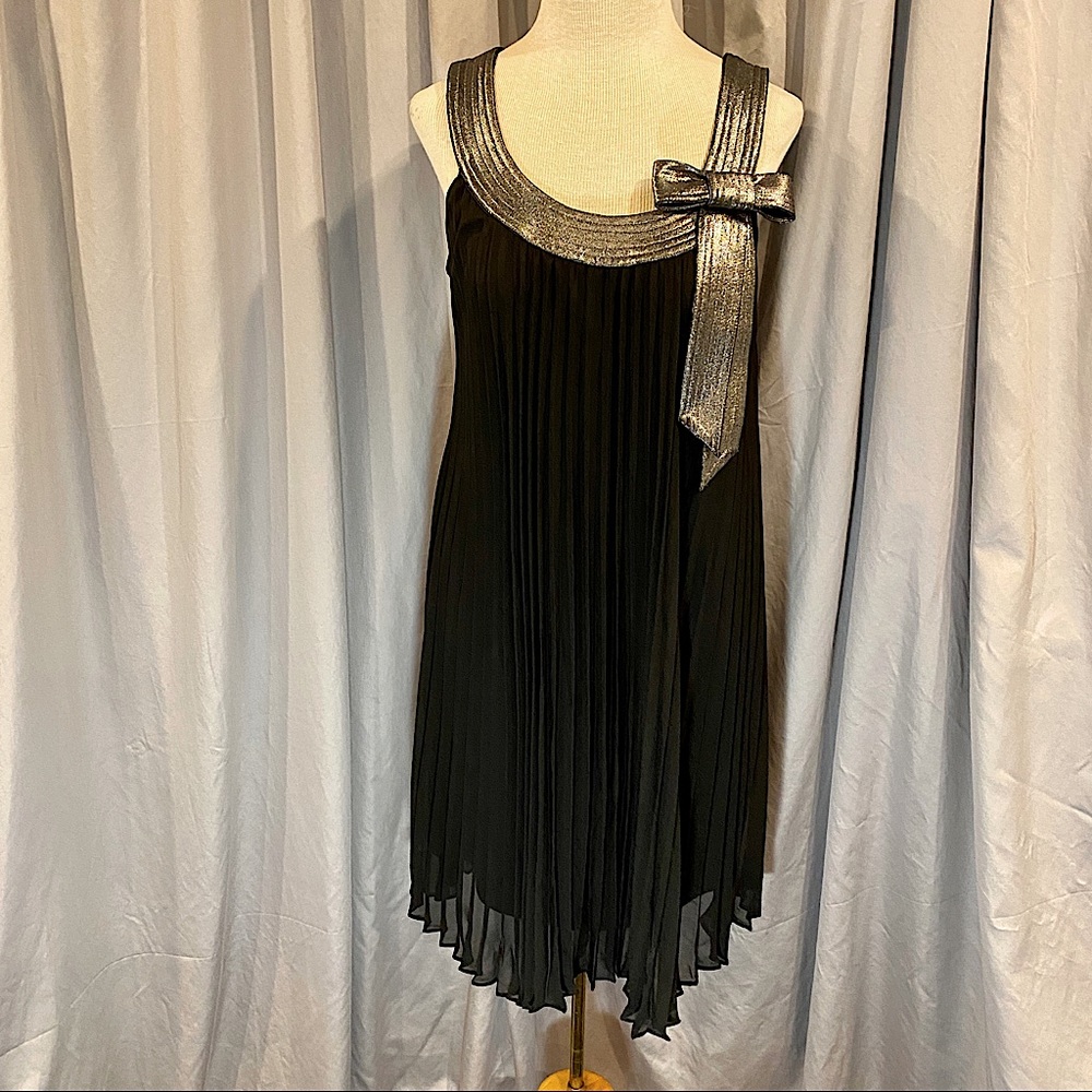 Cocktail dress with metallic trim.  Pleads allow room and flow.